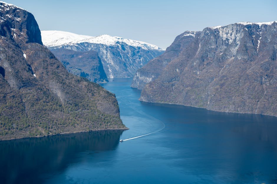 Stunning landscape of Aurlandsfjorden with clear waters and towering cliffs in Norway.