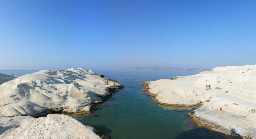 Stunning view of Sarakiniko Beach's unique white rock formations in Milos, Greece.