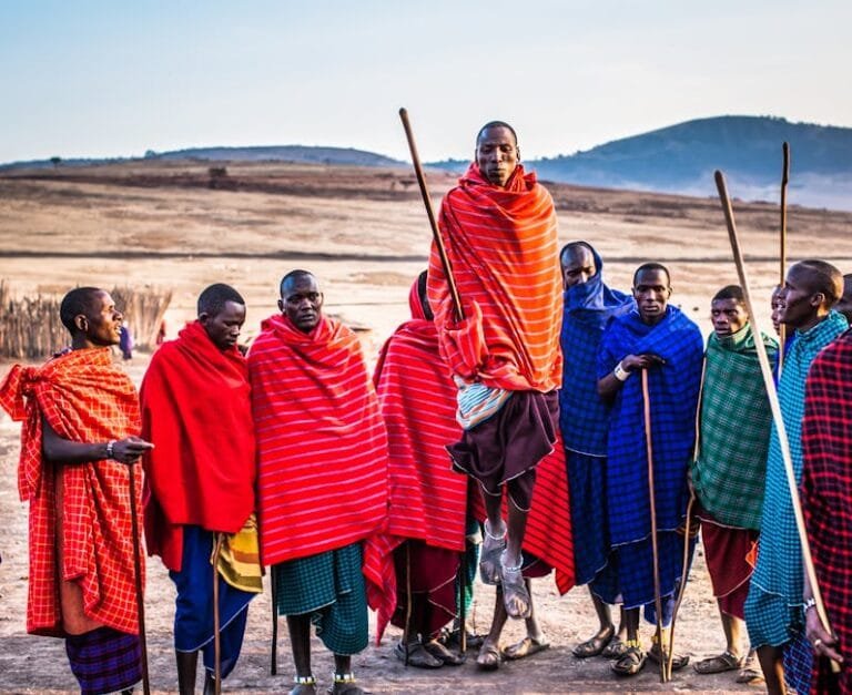 A group of Maasai men in vibrant traditional attire