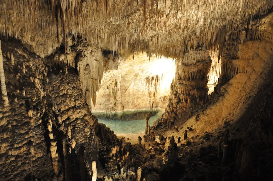 Explore the stunning rock formations and serene waters inside a Majorca cave.