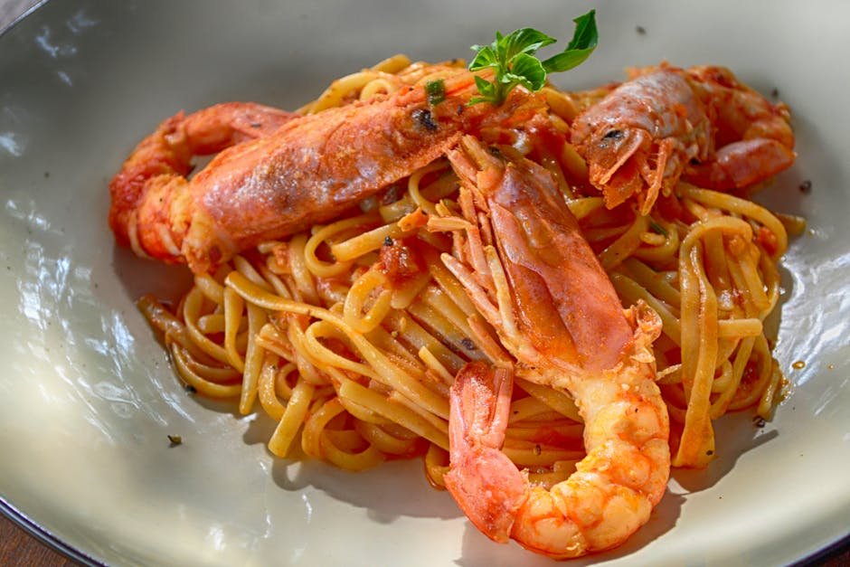 Close-up of a flavorful seafood pasta dish with king prawns, perfectly cooked with Italian flavors.