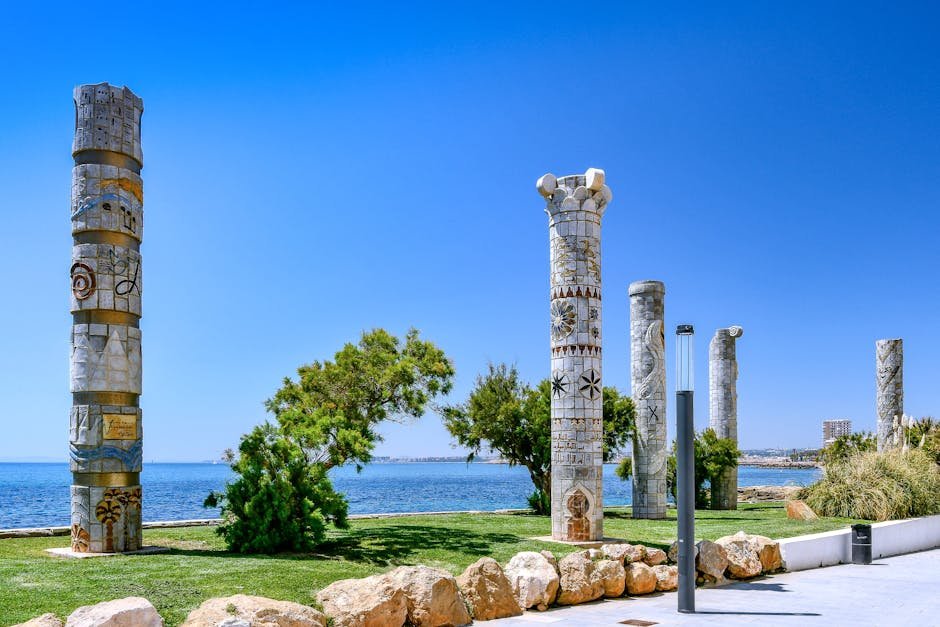 Mosaic columns by the Mediterranean Sea with clear sky in Torrevieja, Spain.