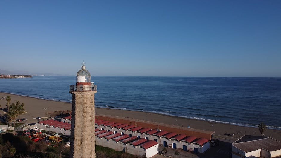 A beautiful view of the Estepona lighthouse and beach, ideal for travel and tourism visuals.