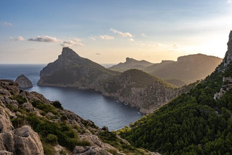 Majestic view of Cap de Formentor on the Mallorcan coast at sunset displaying stunning cliffs and the Mediterranean Sea.