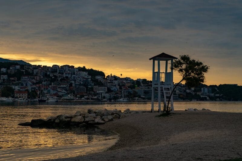 Serene beach scene during sunset in Split, Croatia with coastal charm.