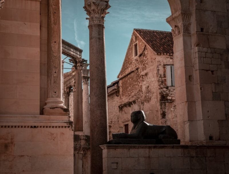 Explore the historic charm of Diocletian's Palace in Split, Croatia, featuring ancient architecture and stone sculptures.