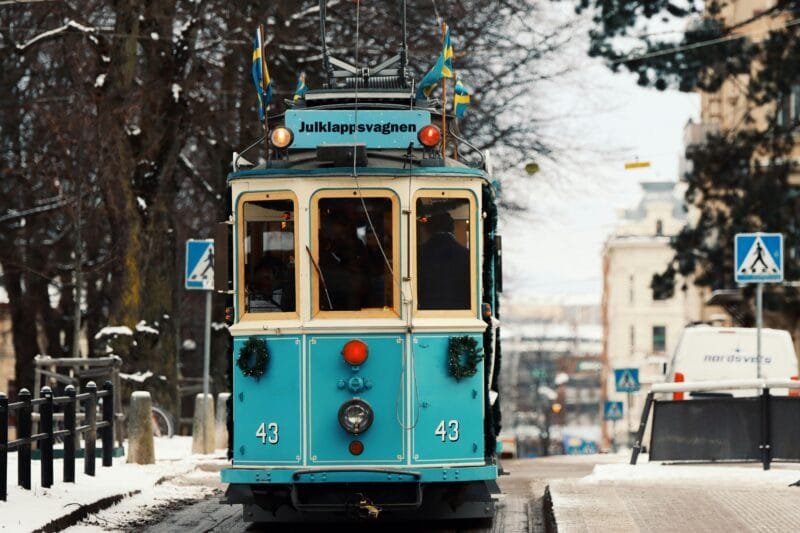 Colorful tram decorated for winter in Gothenburg, Sweden street scene.