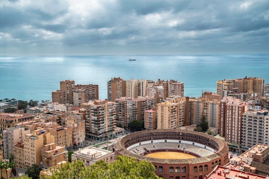 city, buildings, sea, bullring, malaga, spain, coast, landscape, horizon, sky, clouds, scenery, malaga, malaga, nature, malaga, malaga, malaga, spain, spain, spain, spain